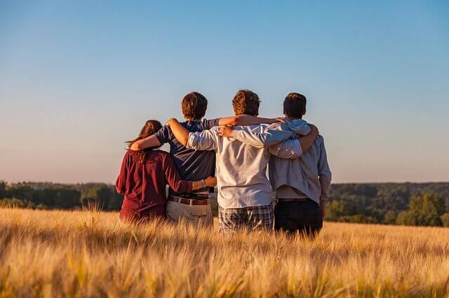 A group of friends sitting in the field