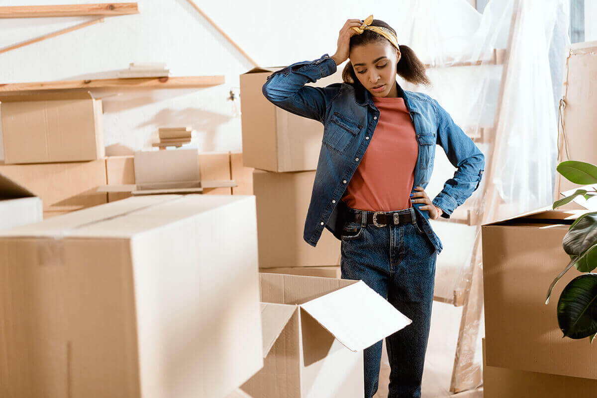 a worried girl looking at the boxes