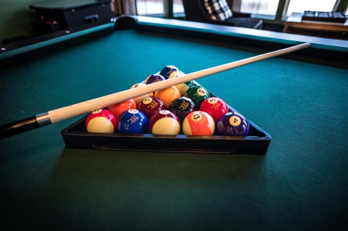 pool table with cues