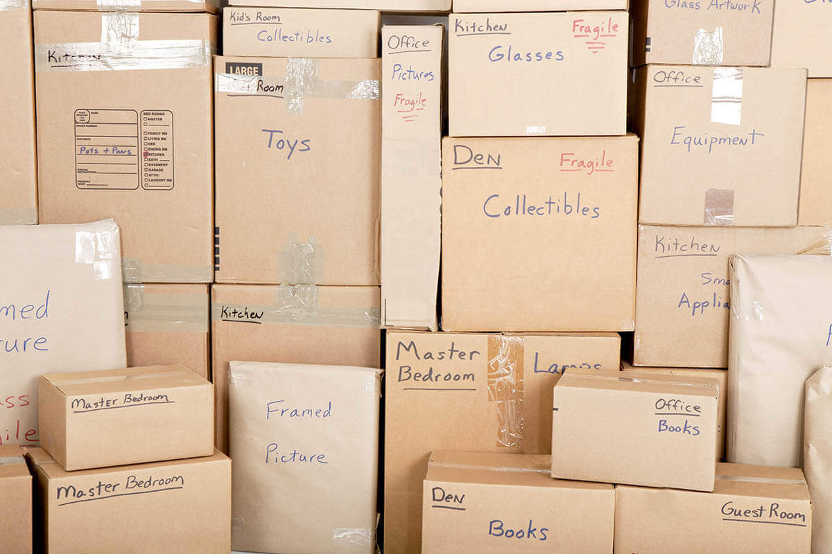 Labeled boxes and other items in an empty place