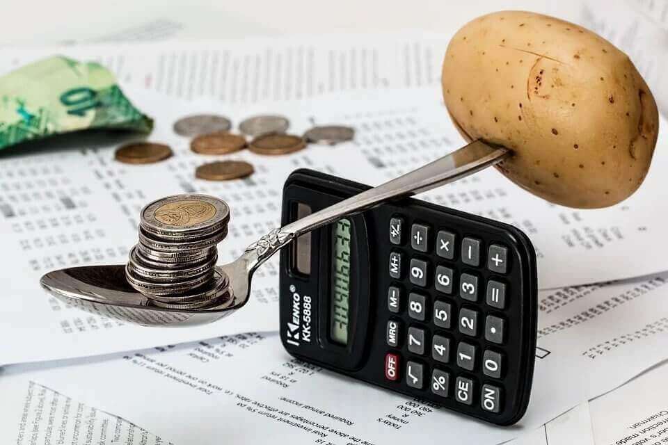 a calculator coins and potato