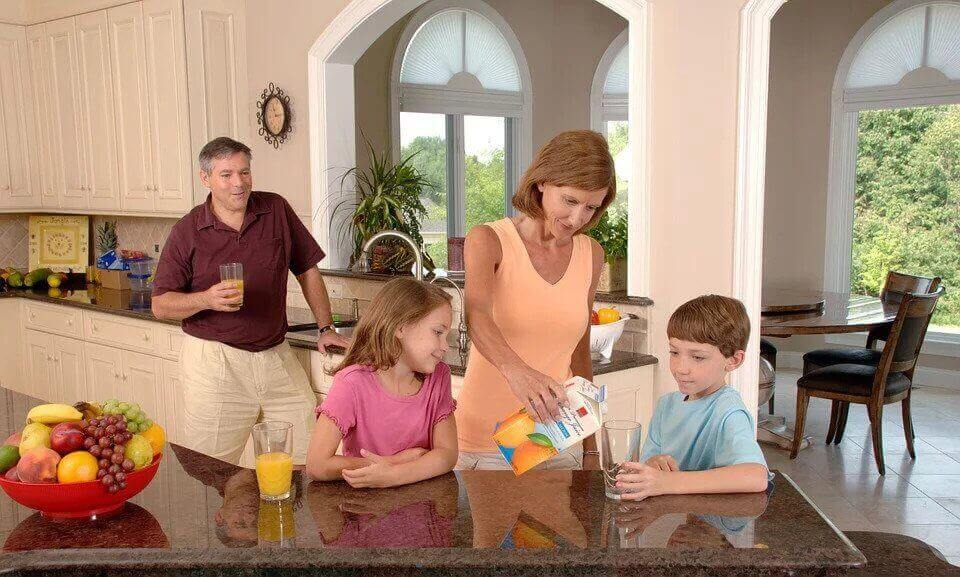 family drinking orange juice