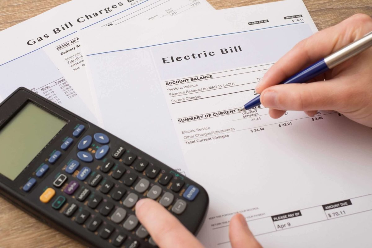 Electric Bill with Pen and Calculator