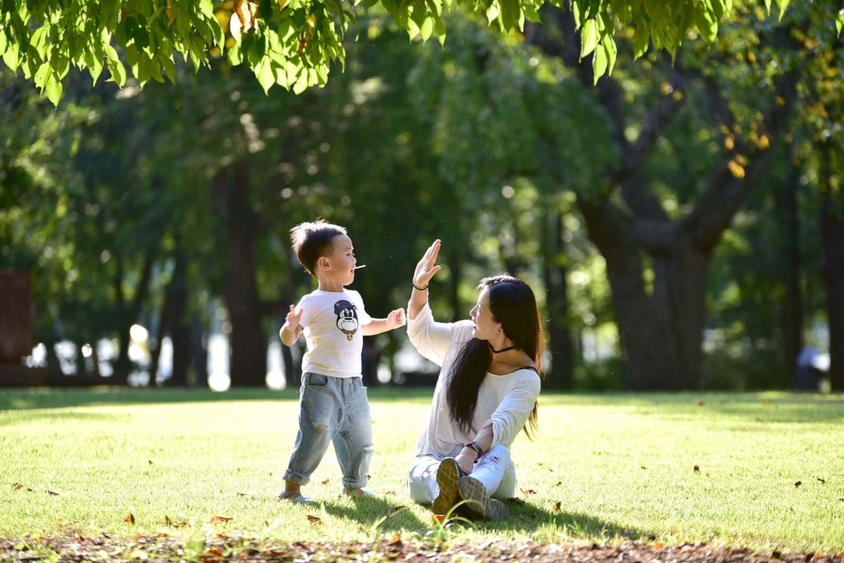 woman and kid in a park