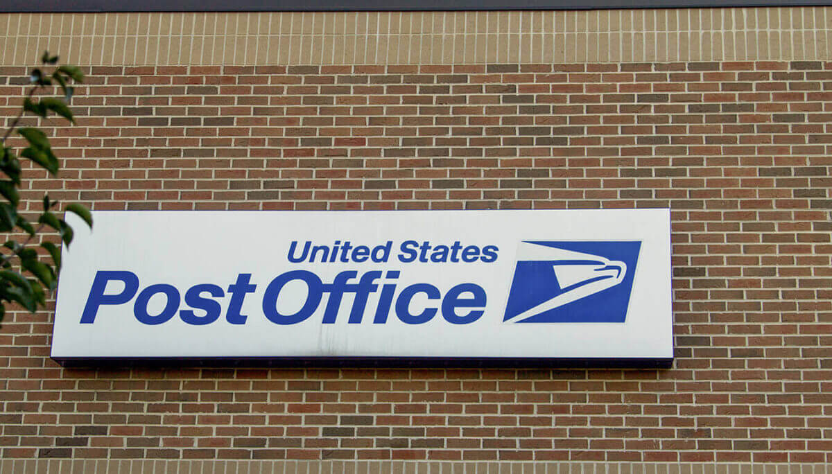 United States Postal Service sign on a wall