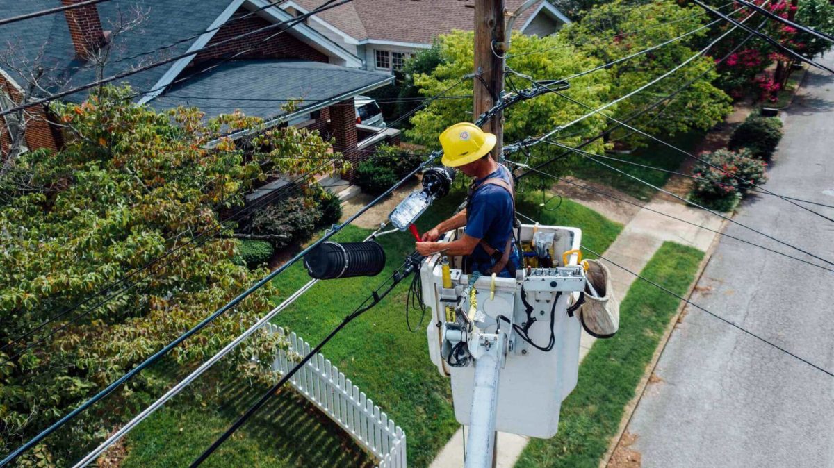 A man repairing wires
