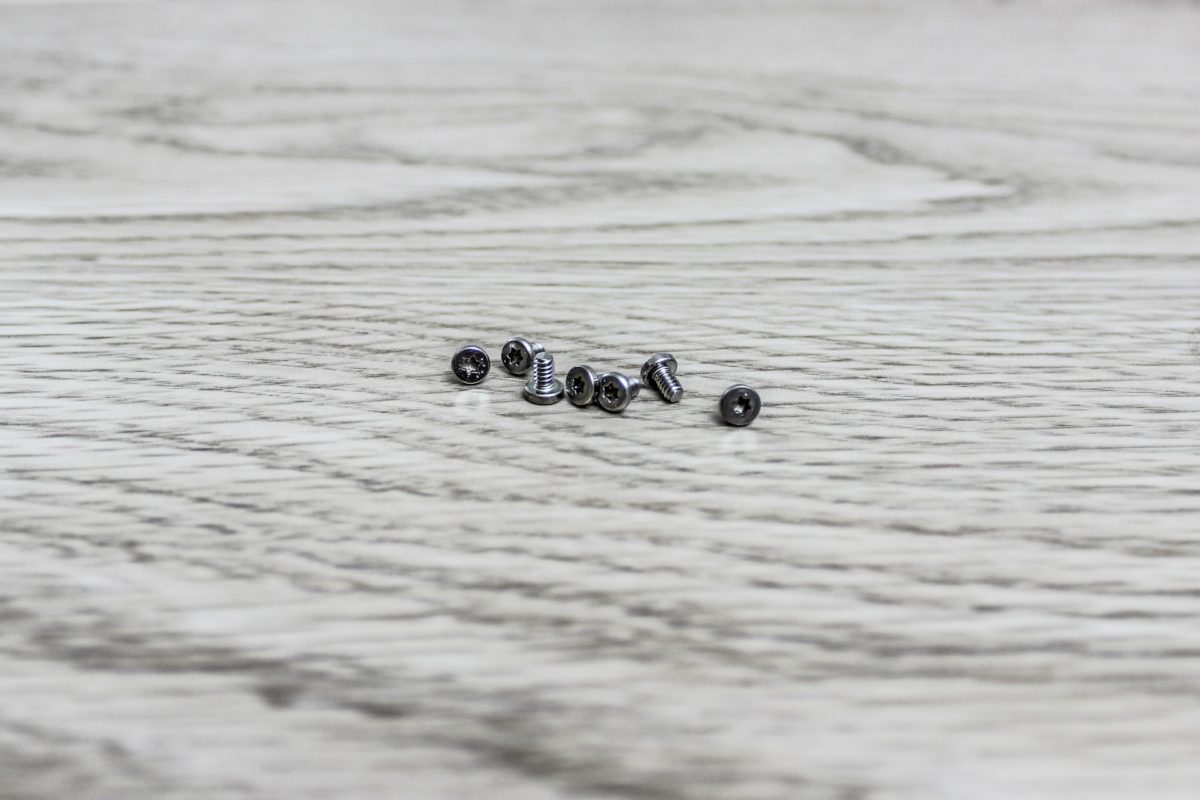 A pile of screws on the floor