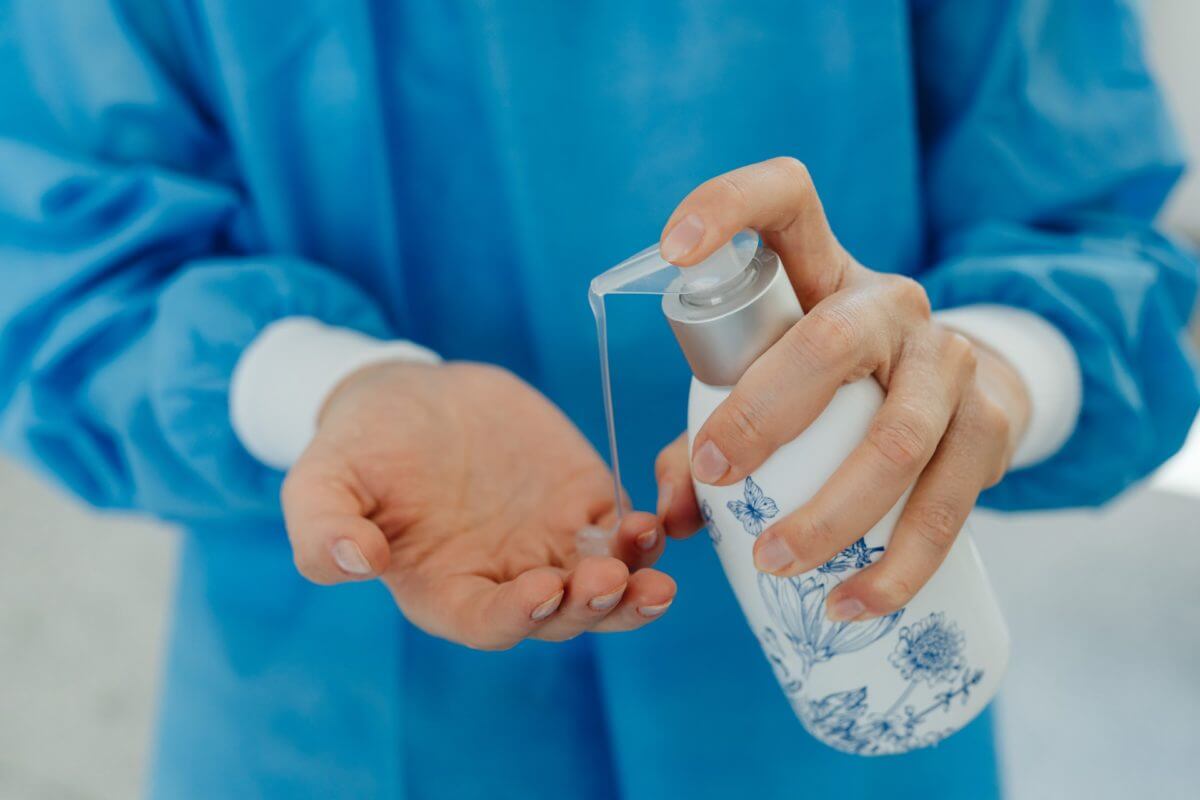 A man holding a hand sanitizer