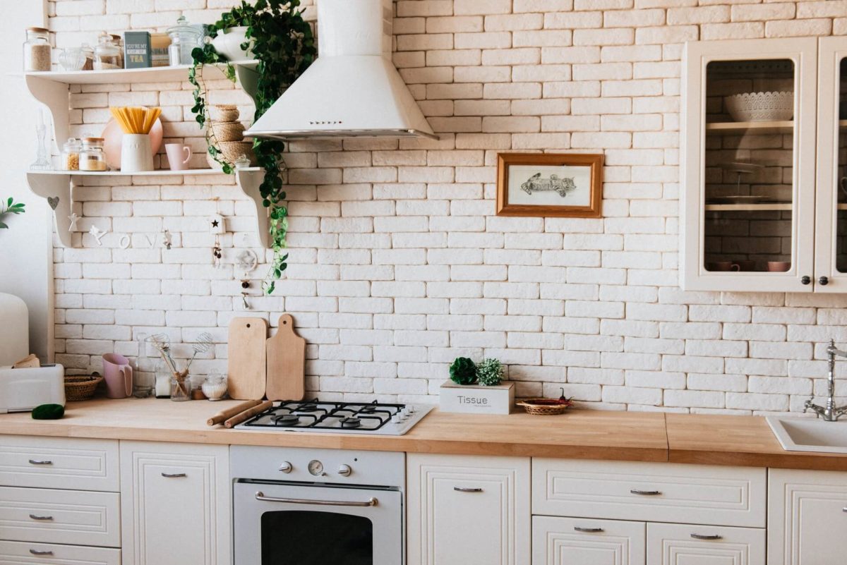 A brick kitchen wall spruced up after long-distance moving