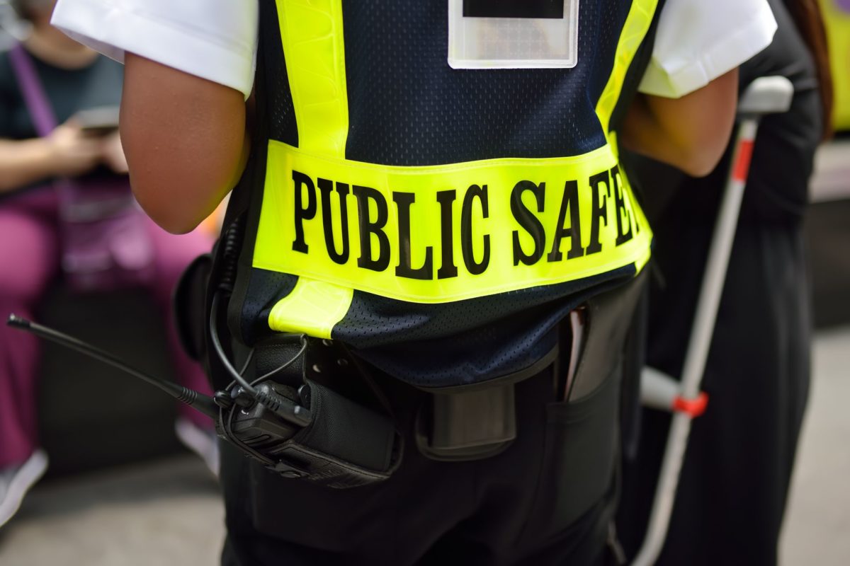 police officer wearing public safety vest