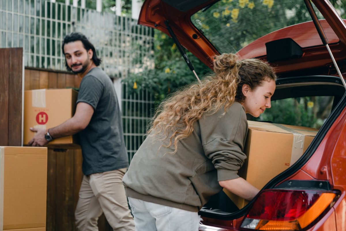 couple is putting boxes in car
