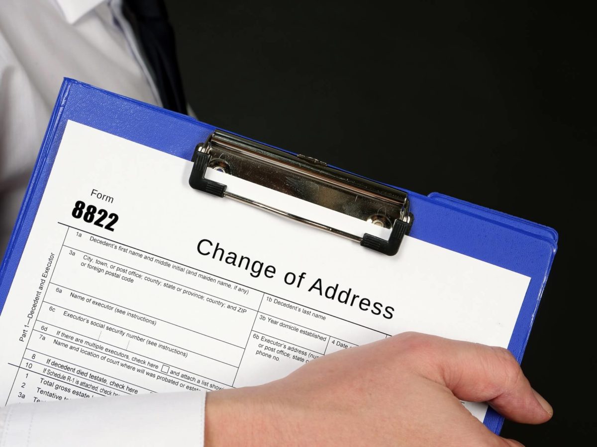 Man filing the Change of Address form before moving cross-country