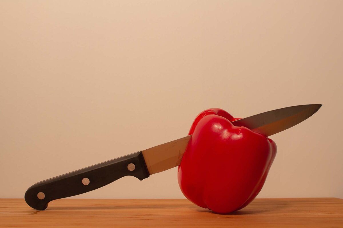 red bell pepper and a knife