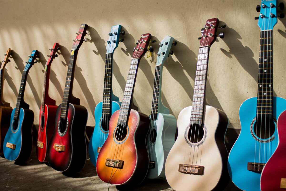 A row of acoustic guitars being prepared for cross-country moving