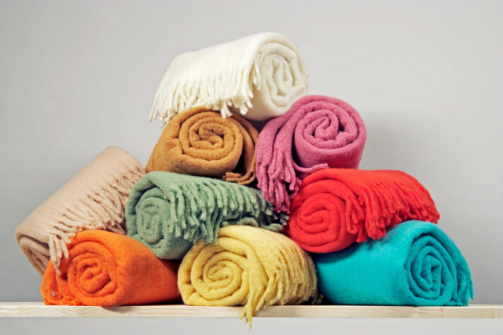 A bunch of different-colored blankets