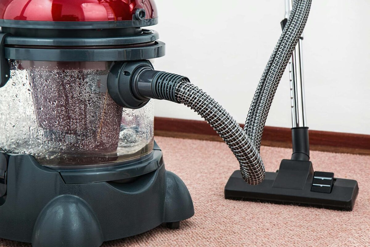 A water-based vacuum cleaner on a carpet