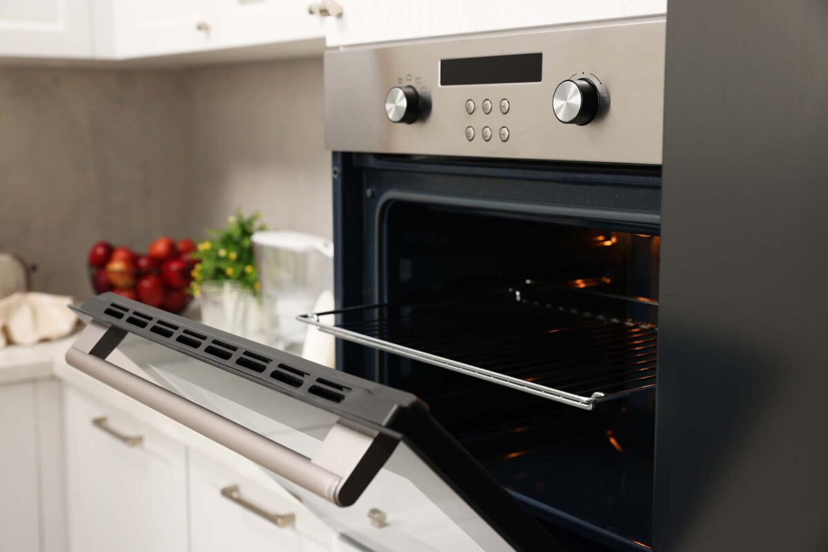 Open electric oven in kitchen. Cooking appliance