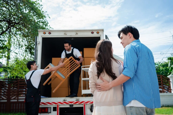 couple overlooking a move with a long distance moving company