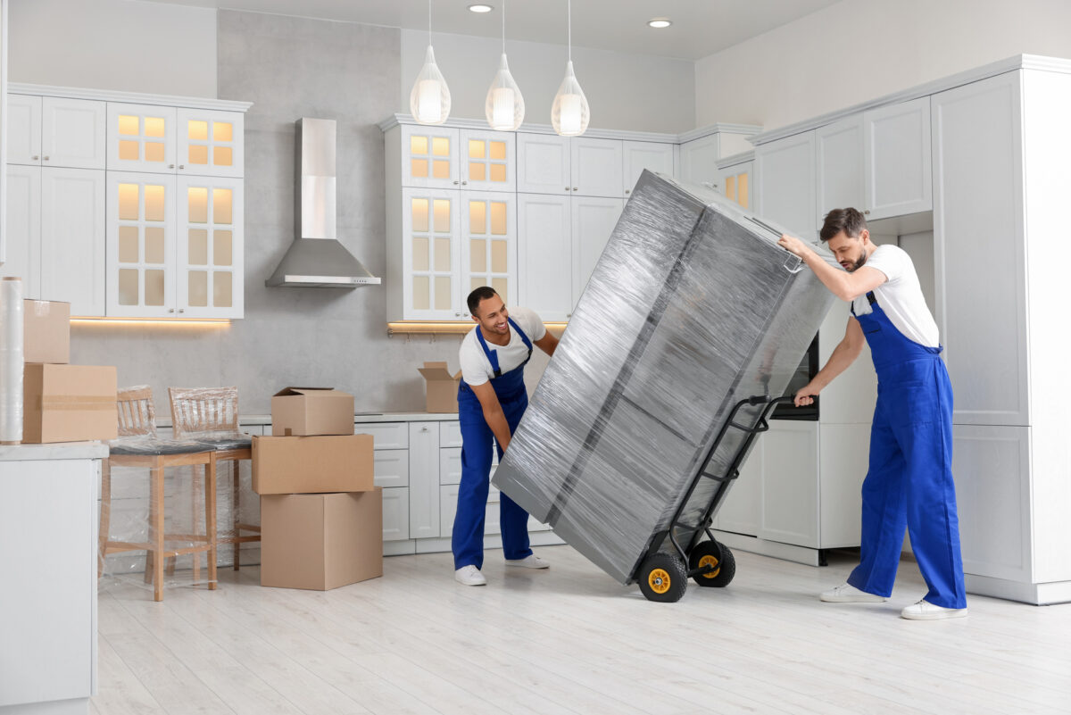 Professional movers packing furniture